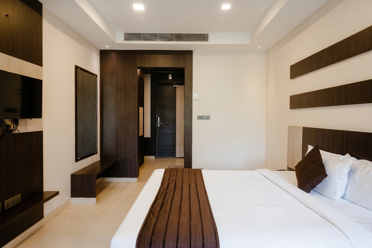 Premium Room bed, wardrobe, and entry view at D'Wayfarer Inn