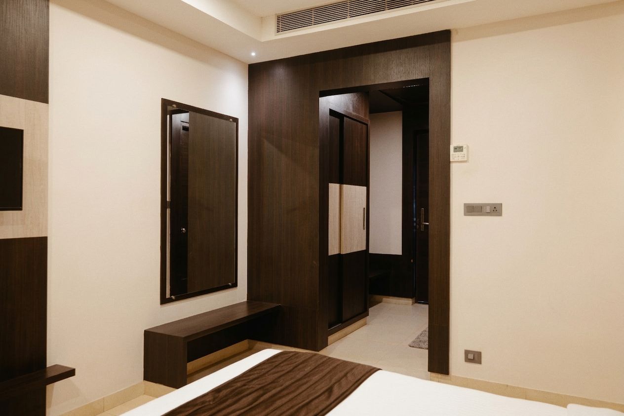 Premium Room bathroom with vanity, shower area, and towels at D'Wayfarer Inn