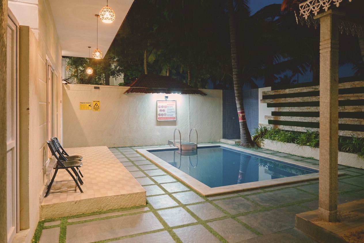 D'Ara Private Pool Villa private pool courtyard with seating and night lighting at D'Wayfarer Inn