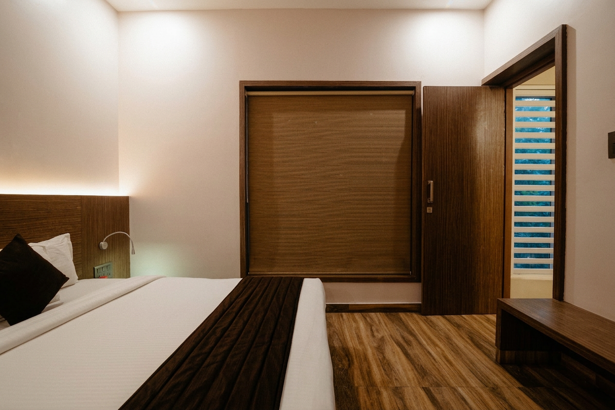 D'Ara Duplex Garden Villa bedroom with bed, large window, and warm wooden interiors at D'Wayfarer Inn